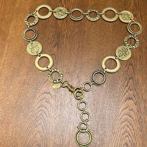 The Limited chunky gold imprinted detail. About 38” length. Made in Italy.